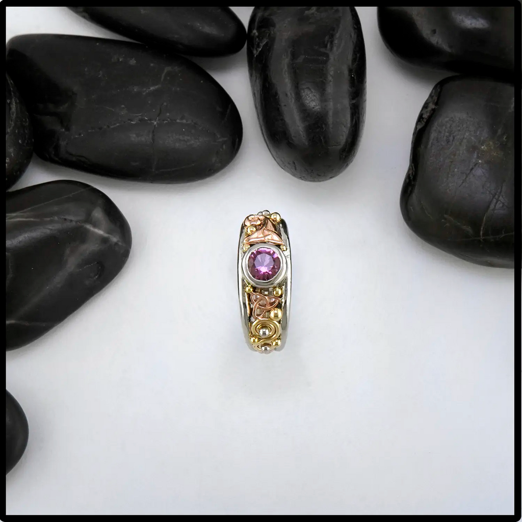 Pink Spinel ring set in tri-color gold Celtic ring