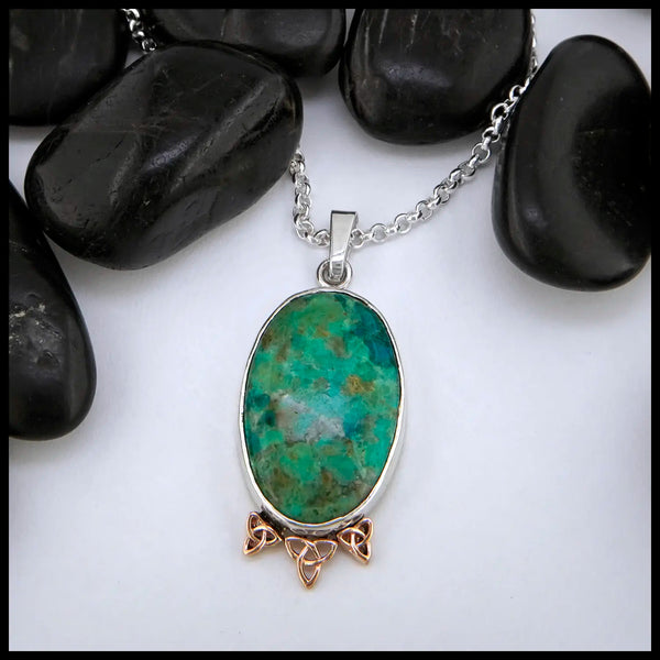 Chrysocolla Pendant set in sterling silver with gold accents
