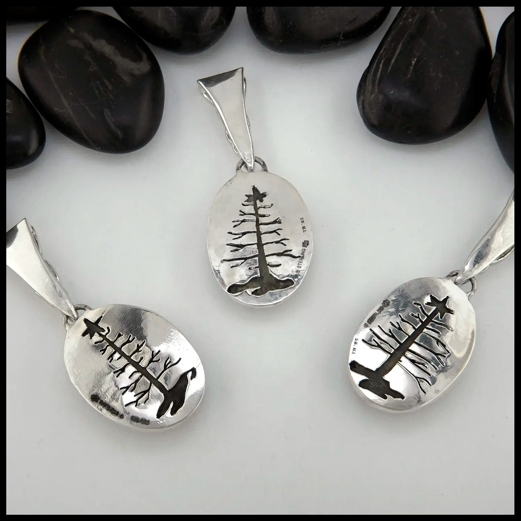 Sea Sediment Jasper with pine tree cut out on the back of the pendant in Sterling Silver