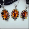 Three Amber Pendants in Sterling Silver and 14K/18K Gold