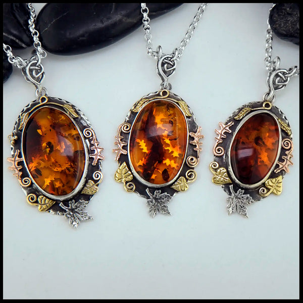 Three Amber Pendants in Sterling Silver and 14K/18K Gold