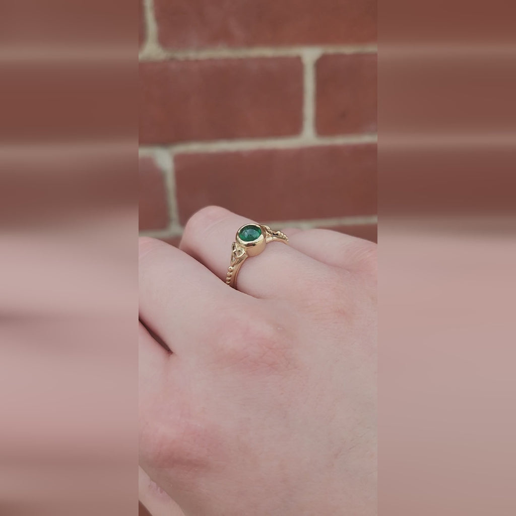 Trinity Knot Emerald Ring shown worn