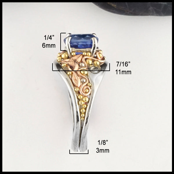 Ring measures 7/16" at widest point and 1/8" at tapered band