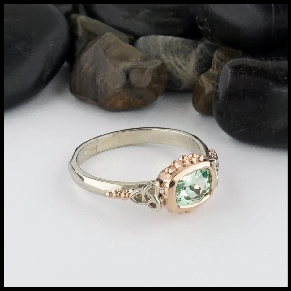 This Mint Garnet is set in a 14K Yellow and Rose Gold frame