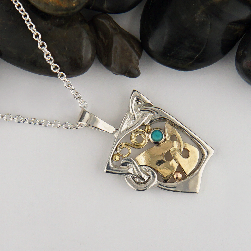Custom pendant in Sterling Silver and 18K Yellow Gold, set with a 2mm Turquoise stone.