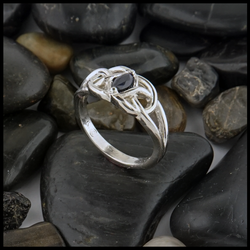This 14K white gold ring is set with a 6X3 Marquise Sapphire stone. 
