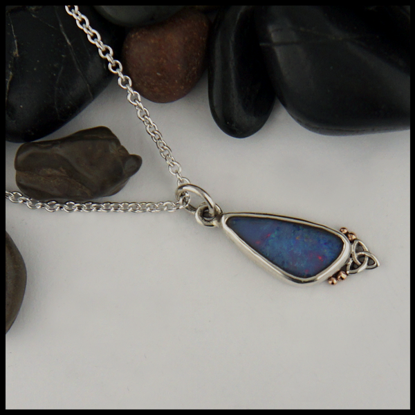 Custom Asymmetrical Sterling Silver pendant with 14K Rose Gold details with a bezel set gray Opal.