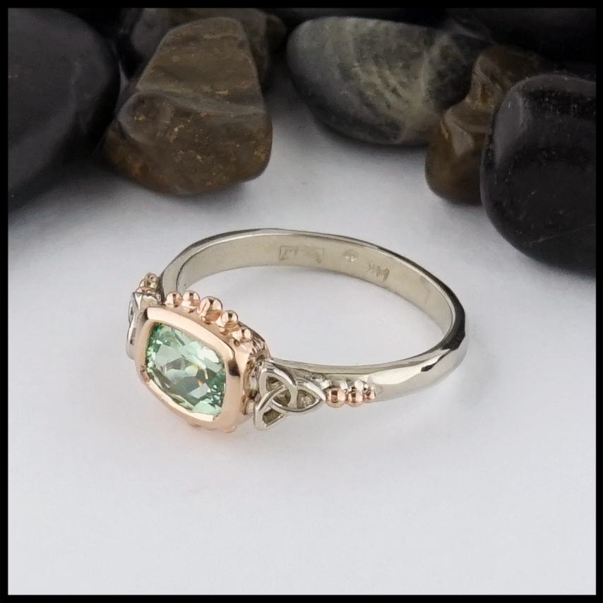 This Mint Garnet is set in a 14K Yellow and Rose Gold frame