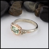 This Mint Garnet is set in a 14K Yellow and Rose Gold frame