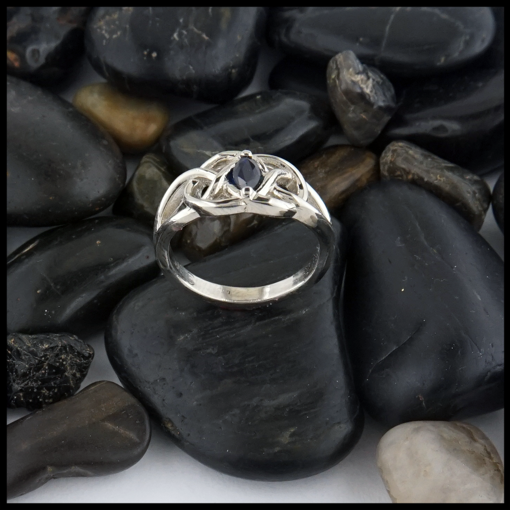 This 14K white gold ring is set with a 6X3 Marquise Sapphire stone. 