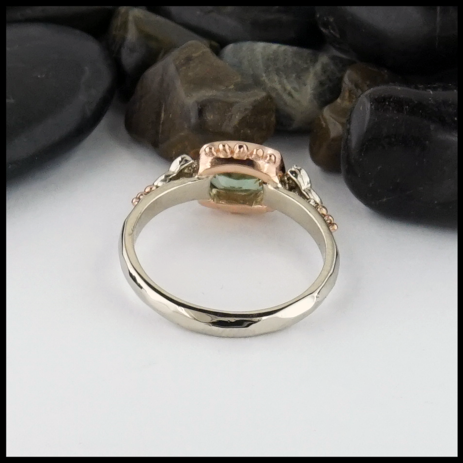 This Mint Garnet is set in a 14K Yellow and Rose Gold frame