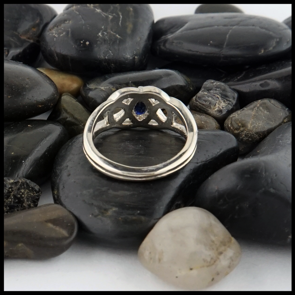 This 14K white gold ring is set with a 6X3 Marquise Sapphire stone. 