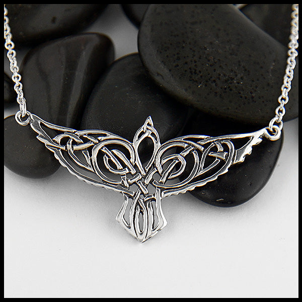 Sterling Silver celtic knot Raven pendant on attached cable chain.