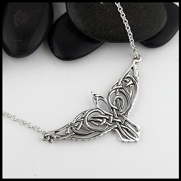 Sterling Silver celtic knot Raven pendant on attached cable chain.