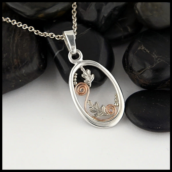 Leaf Flourish pendant in Sterling Silver with 14K Rose Gold spirals and  14K White Gold oak leaves and bead accents.