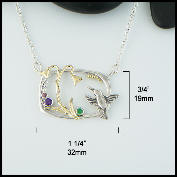 Hummingbird and Flower Pendant measures 3/4" by 1 1/4".