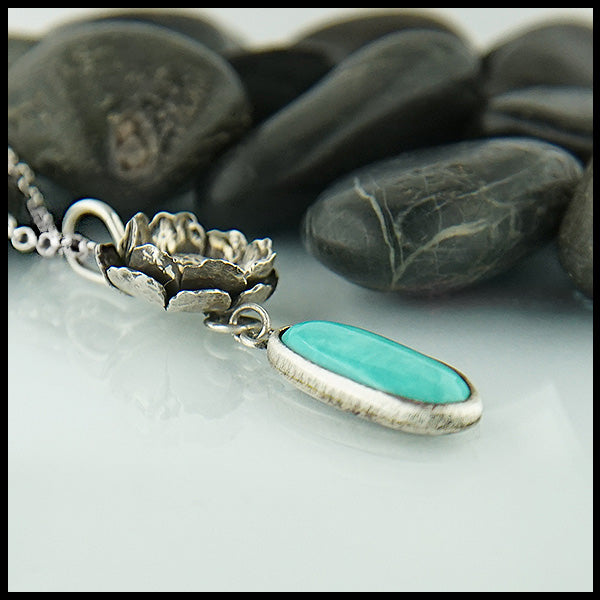 Profile view of Floral Turquoise pendant in sterling silver