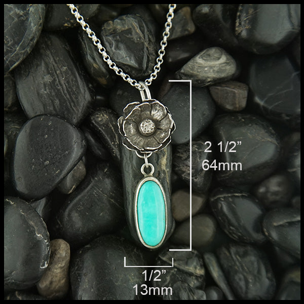 Floral Turquoise pendant in sterling silver  measures 2 1/2" by 1/2"