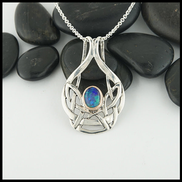 Art Nouveau Pendant in sterling silver with a black opal doublet set in a 14K rose gold bezel.