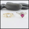 Separate view of two piece ring set in Yellow Gold and 14K White. The first ring interlocks and holds the heart creating the traditional Claddagh. The second  ring is set with a 1ct heart shaped Ruby and has 5 diamonds on either side. 
