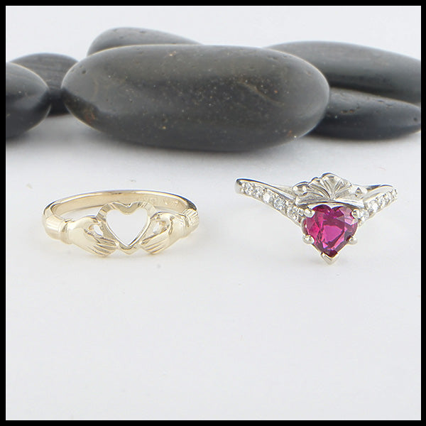 Separate view of two piece ring set in Yellow Gold and 14K White. The first ring interlocks and holds the heart creating the traditional Claddagh. The second  ring is set with a 1ct heart shaped Ruby and has 5 diamonds on either side. 