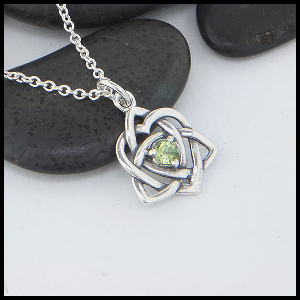 Limited Edition Trinity Knot Heart Pendant set with a 4mm Peridot.