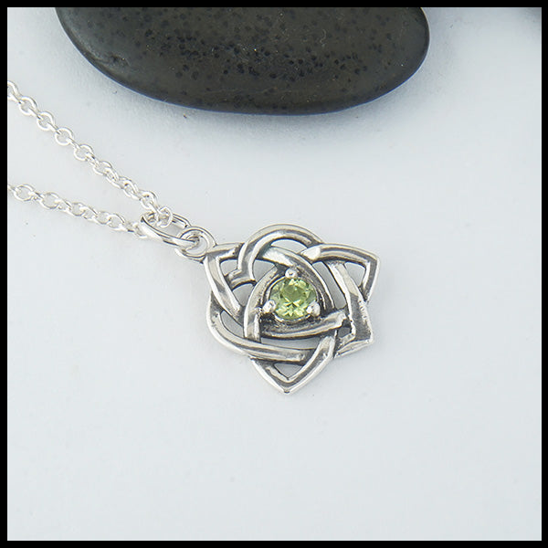Limited Edition Trinity Knot Heart Pendant set with a 4mm Peridot.