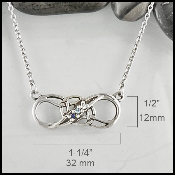 Infinity Knot birthstone Pendant in Sterling silver measures 1/2" by 1 1/4"