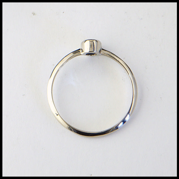 Profile view of simple 14K White Gold ring bezel set with a 0.36ct Oval Ceylon Blue Sapphire. 