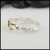 Side view of rustic hand fabricated ring in sterling silver with an 18K yellow gold bezel, set with a Rose Cut Mint Green Tourmaline.