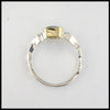 Profile view of rustic hand fabricated ring in sterling silver with an 18K yellow gold bezel, set with a Rose Cut Mint Green Tourmaline.