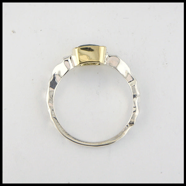 Profile view of rustic hand fabricated ring in sterling silver with an 18K yellow gold bezel, set with a Rose Cut Mint Green Tourmaline.