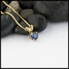 5mm Ceylon Blue Sapphire set in a 14K yellow gold setting with an 18" 14K Yellow Gold light curb chain.