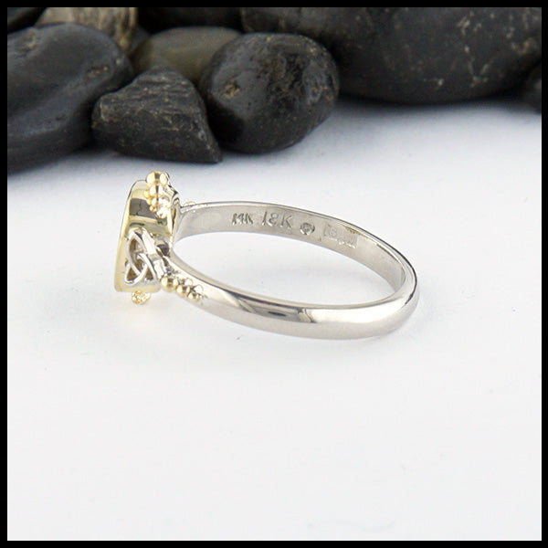 Profile view of Opal trinity ring with 0.54ct Black Opal and 14K White trinity accents and 18K Yellow Gold. 