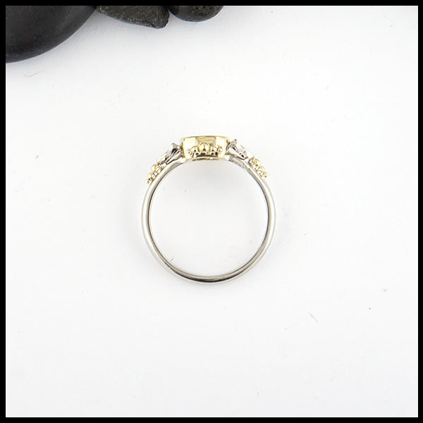 Profile view of Opal trinity ring with 0.54ct Black Opal and 14K White trinity accents and 18K Yellow Gold. 