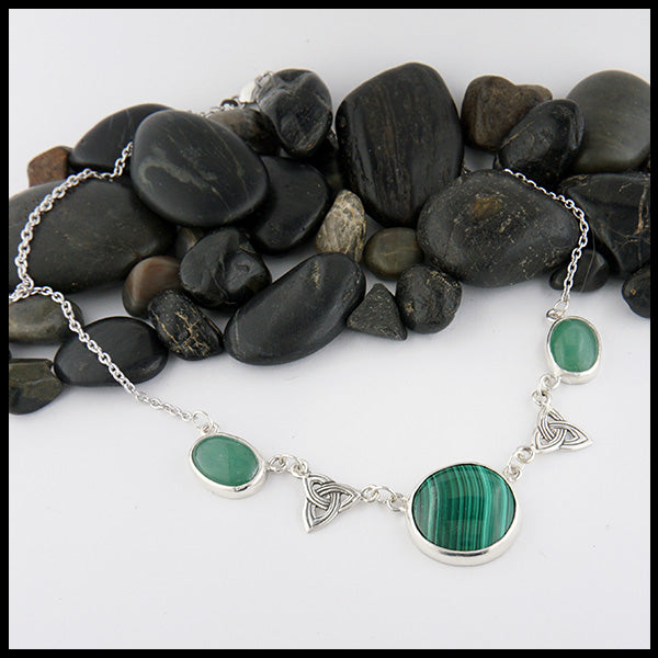 Celtic link necklace with a Malachite center stone and two side stones of Adventurine with two accent trinity knots. 