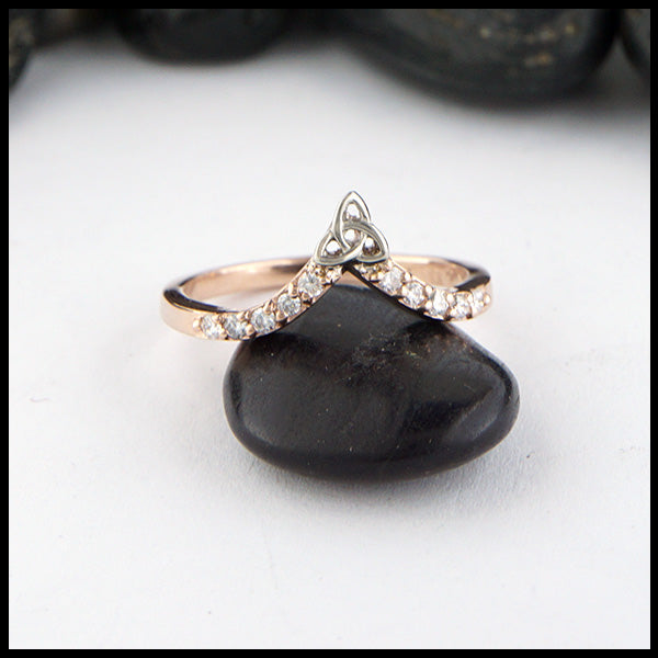 14K Rose gold chevron stacking band with ten 1.5mm diamonds with a 14K white gold trinity knot. 