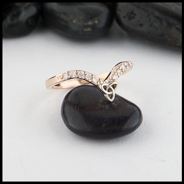 14K Rose gold chevron stacking band with ten 1.5mm diamonds with a 14K white gold trinity knot. 