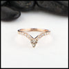 14K Rose gold chevron stacking band with ten 1.5mm diamonds with a 14K white gold trinity knot. 