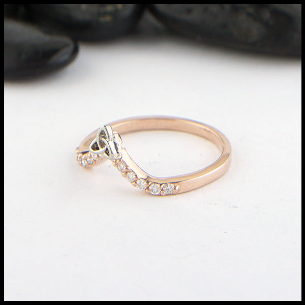 14K Rose gold chevron stacking band with ten 1.5mm diamonds with a 14K white gold trinity knot. 