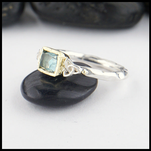 Sterling Silver and 18K yellow gold ring set with a Rose Cut Blue Tourmaline with trinity knot accents.