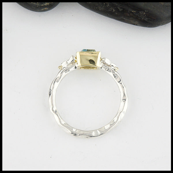 Profile view of Sterling Silver and 18K yellow gold ring set with a Rose Cut Blue Tourmaline with trinity knot accents.