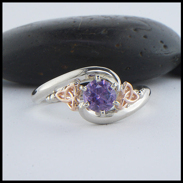 Custom 14K White Gold band with 14K rose gold trinity accents and a stunning purple sapphire. 