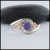 Custom 14K White Gold band with 14K rose gold trinity accents and a stunning purple sapphire. 