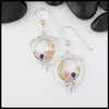 Custom Sterling Silver,14K Rose and 18K yellow gold earrings set with a 3mm Sapphire. 