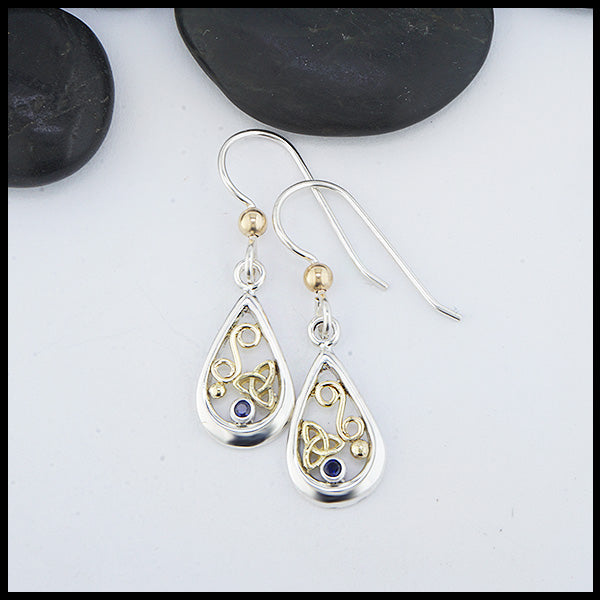 Custom Sterling Silver tear drop earrings with 18K Yellow Gold trinity knots and accents, set with a 2mm Sapphire. 