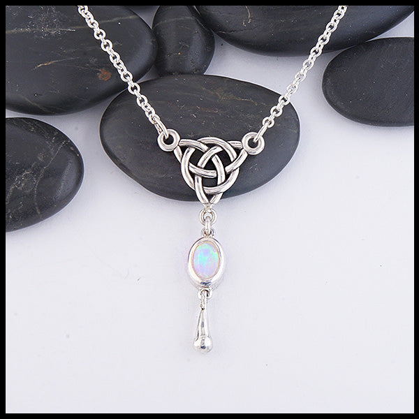 Custom Opal Dew Drop necklace featuring an opal set in Sterling Silver connected to a Triskele. Shown on an attached 18" cable chain.