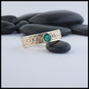 Josephine's Knot band in 14K Yellow Gold with Emerald
