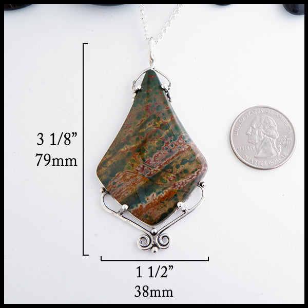 Bloodstone Twist pendant measures 3 1/8" by 1 1/2". Size shown in comparison to a quarter.