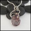 Custom Crazy Lace Agate pendant with a hand fabricated sterling silver setting.